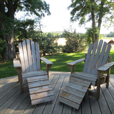 photo: Farm Stay at the Gite — Two chairs on the deck | Monteillet Fromagerie
