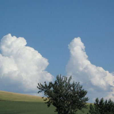 Photo of Clouds in Blue Sky Over the Hills at Monteillet Fromagerie