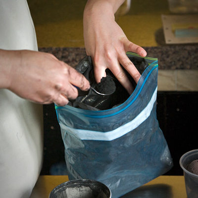 Photo of Scooping Ash for Le Roi Noir Soft Cheese, Monteillet Fromagerie