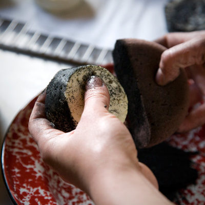 Preparing Le Roi Noir by coating at Monteillet Fromagerie, Photo by Steve Scardina