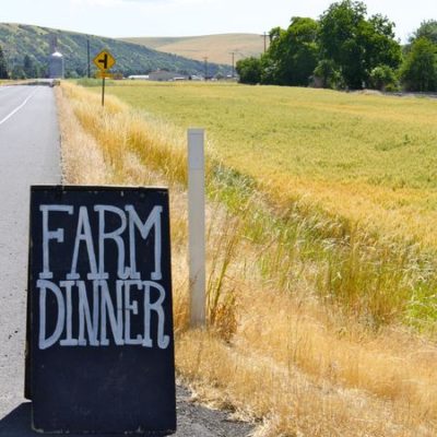 photo of Farm Dinner sign—2011 Outstanding in the Field Dinner—photo by The Farm Chicks