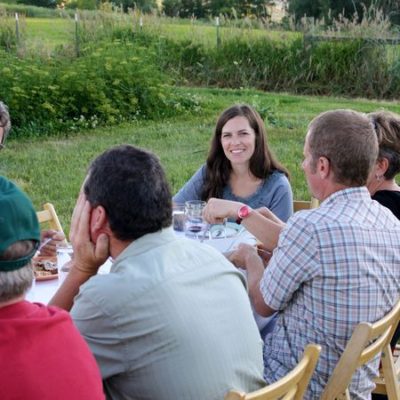 photo of people feasting—2011 Outstanding in the Field Dinner—photo by The Farm Chicks